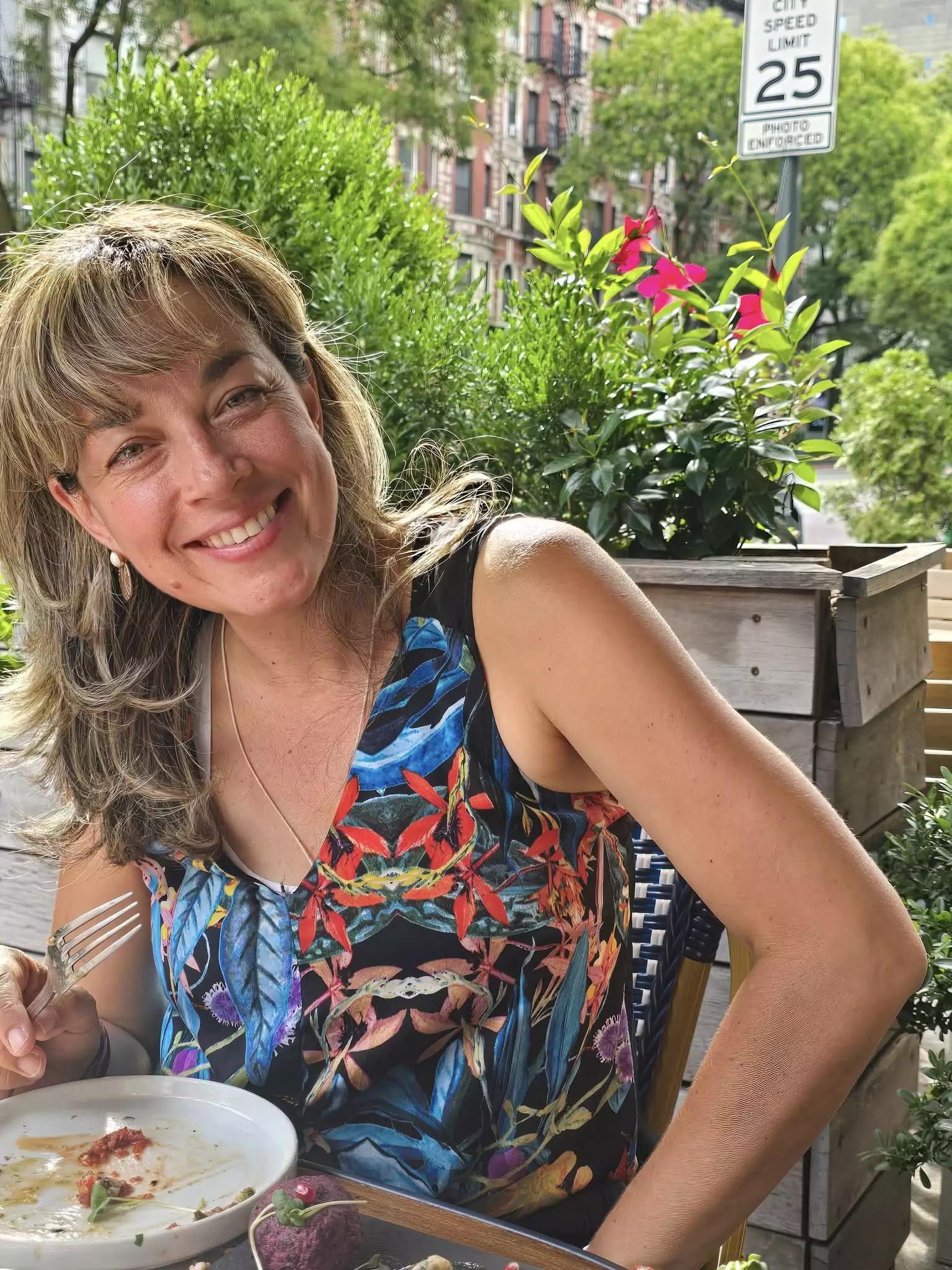 Kena sitting on outdoor patio of Saperavi on 14th stree NYC